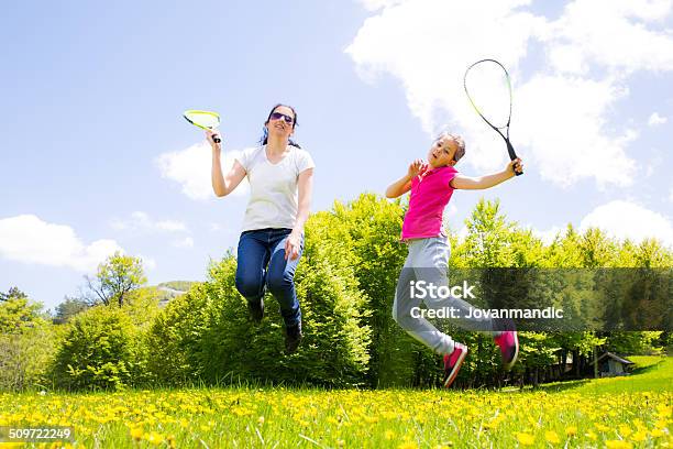 Mother And Daughter Playing Badminton Stock Photo - Download Image Now - Badminton - Sport, Blossom, Family
