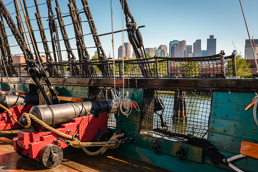 USS Constitution, the oldest commissioned ship in the US Navy and Boston in the background