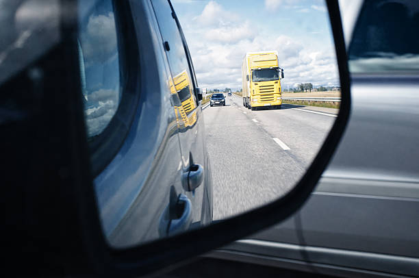 istock Reflection in rear view mirror onto busy interstate road. 509722698