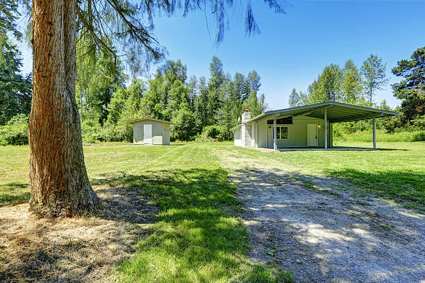 istock Countryside house with walkout basement and small shed 509723309