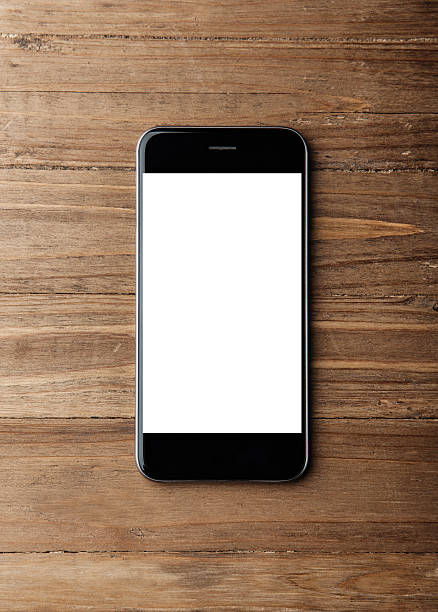 istock Photo of generic design smartphone on wood background. Vertical 509724682