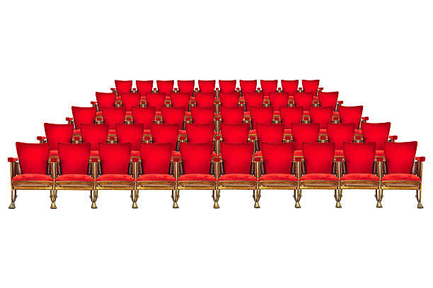 The semicircular rows of beige upholstered chairs in the audience. Seats for listeners in the conference room. Background beige conference room chairs. Concert hall.