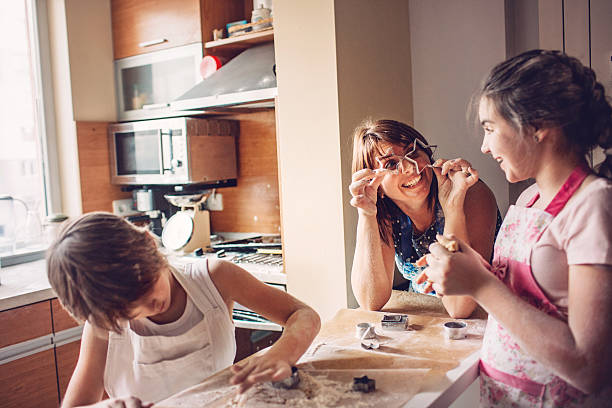 istock Happy family having fun and making cookies 509727286