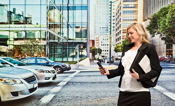 istock Businesswoman using smart phone on road 509728582