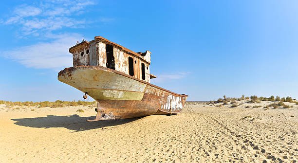 istock Panorama. Old ship in the Aral desert, rear view 509730370