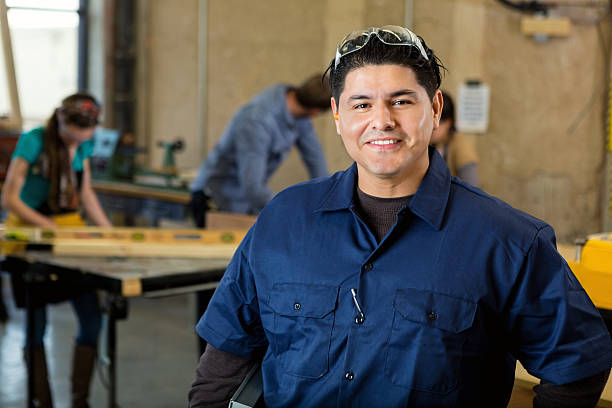 istock Professional craftsman in large workshop with heavy machinery and tools 509731478