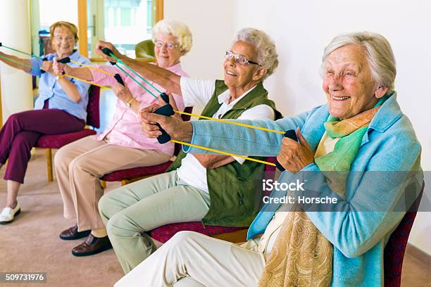 Cheerful Senior Women Exercising Their Arms Stock Photo - Download Image Now - Senior Adult, Exercising, Healthy Lifestyle