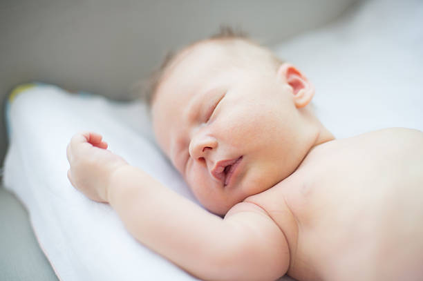 istock little baby boy asleep 509732628