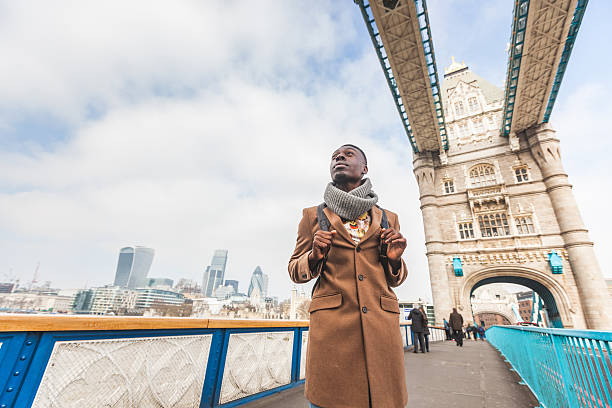 istock Young black man on Tower Bridge in London 509733872