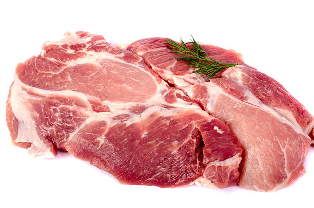 istock Raw pork steak on white background close-up. 509734428