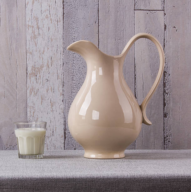 istock Still life with ceramics jug and glass with milk 509734736