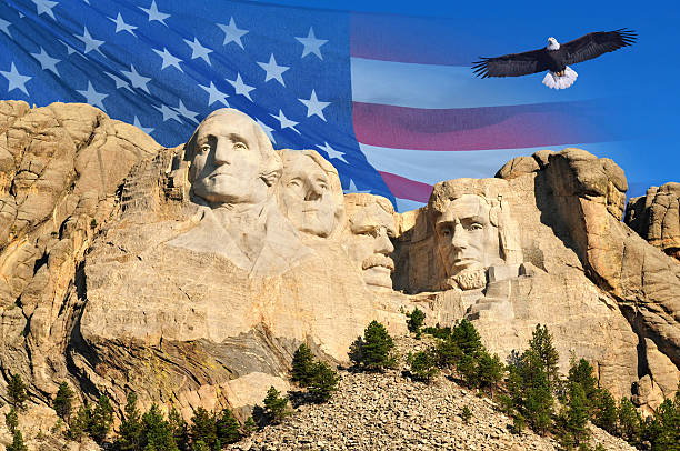 Mount Rushmore Mount Rushmore with American flag background and flying bald eagle in Black Hills, South Dakota, U.S.A. mt rushmore national monument stock pictures, royalty-free photos & images