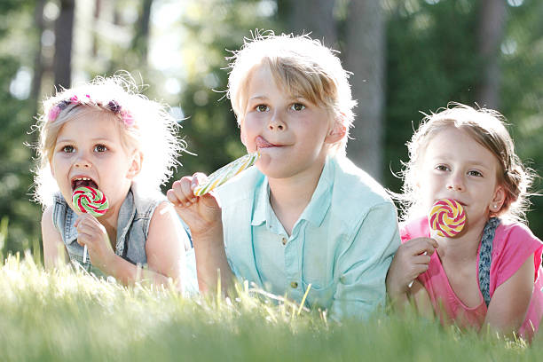 istock Happy children with lollipops 509736628