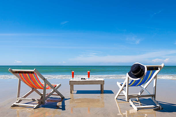 istock Two deckchairs on the beach for leisure during sunny day 509736912