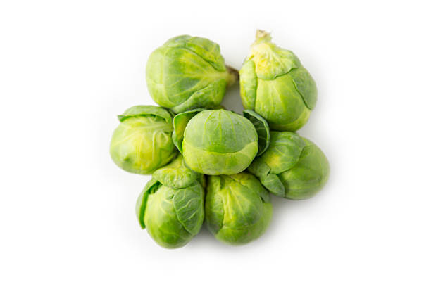 Brussels sprouts, isolated, bird's eye view Isolated studio photo o brussels sprouts. brussels sprout stock pictures, royalty-free photos & images