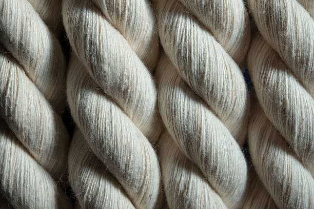 white cotton rope closeup white cotton rope closeup cotton mill stock pictures, royalty-free photos & images