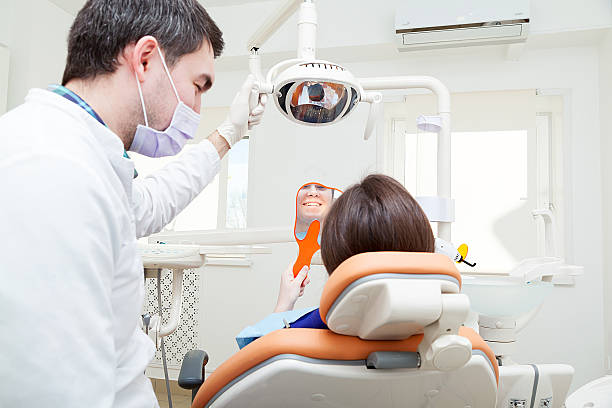 istock female patient visiting dentist for teeth whitening 509740222