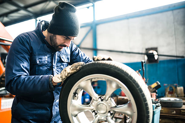 istock tire repairer checking the tire integrity 509740726
