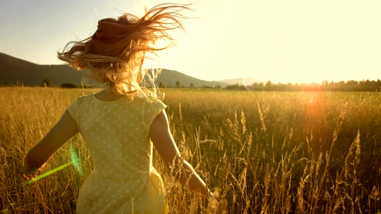 MS TS SLO MO Girl Running In Field At Sunset