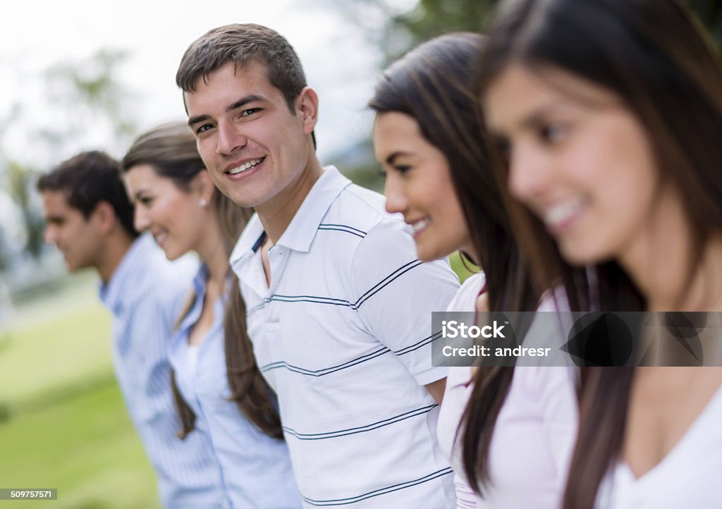 Man with a group of friends Man with a group of friends in a row - outdoors 20-29 Years Stock Photo
