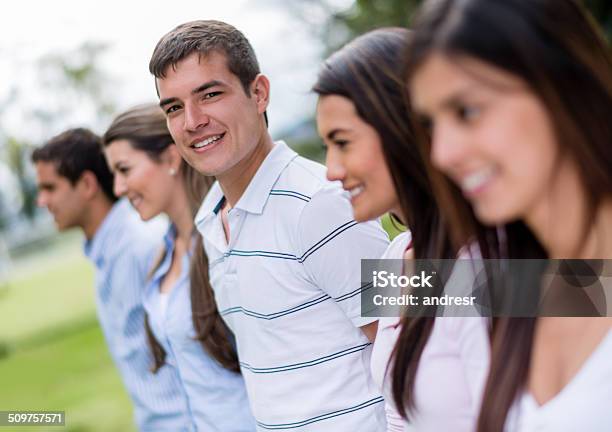 Man With A Group Of Friends Stock Photo - Download Image Now - 20-29 Years, Adult, Adults Only