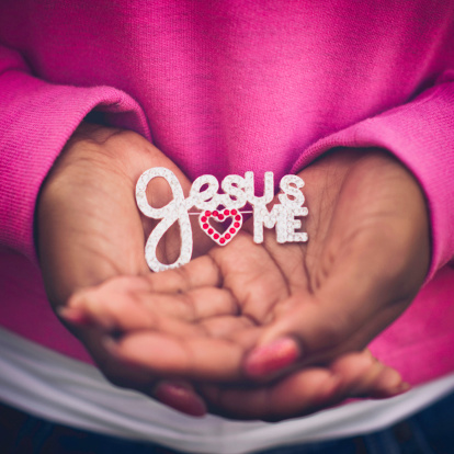 Jesus Loves Me: Hands Holding Spiritual Message