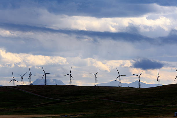 istock Wind Turbines With Dramatic Evening Skies And Mountains 509757679