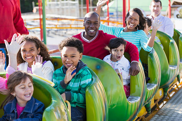 istock Multi-racial children and adults on a rollercoaster 509757803