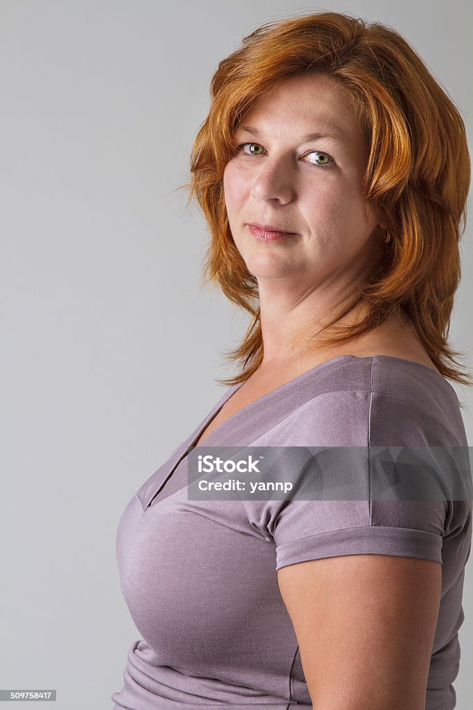 Green eyes and red hair beautiful 40 year old woman with red hair and light green eyes 40-44 Years Stock Photo