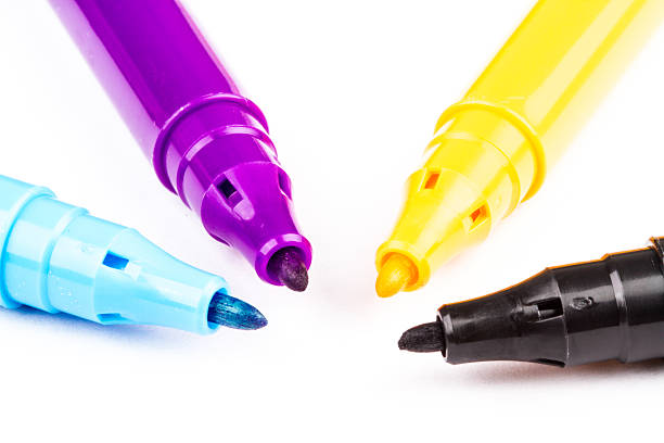 four felt-tip pens with CMYK primary colors stock photo