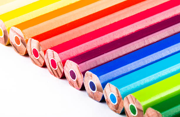 different colored pencils on white background stock photo