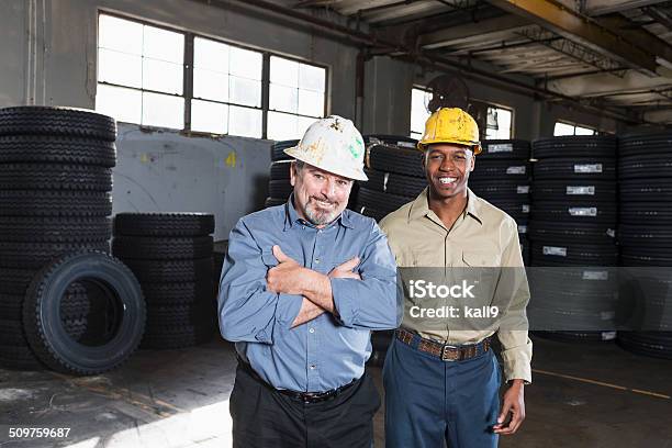 Workers Wearing Hard Hats Stock Photo - Download Image Now - 20-29 Years, 50-59 Years, Adult