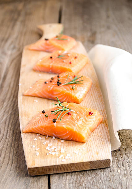 istock Raw salmon steaks on the wooden board 509778771