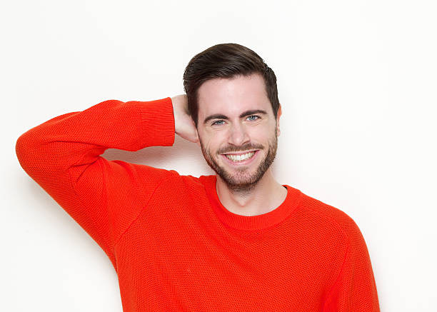 istock Young man smiling with hand in hair 509781173