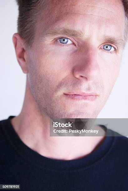 Serious Young Adult Man In Dark Tshirt Looking At Camera Stock Photo - Download Image Now