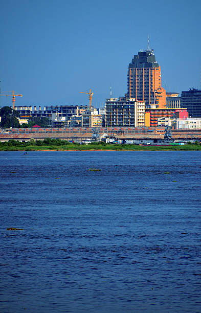 Kinshasa, D.R. Congo: Gombe district riverfront Kinshasa, Democratic Republic of the Congo: Congo river, the port and the Sozacom / Gecamines tower - Gombe district - photo by M.Torres kinshasa stock pictures, royalty-free photos & images