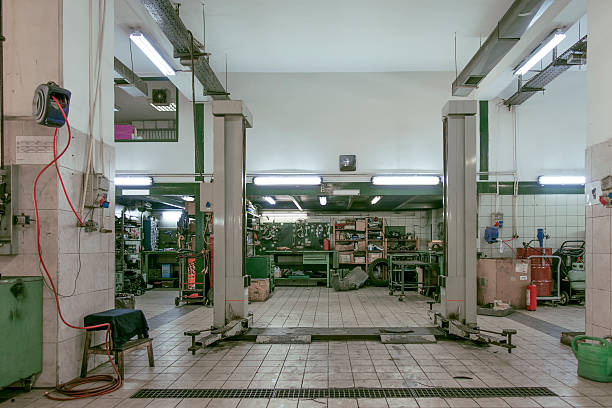 istock Auto Repair Shop Interior with Mechanic in Background 509782593