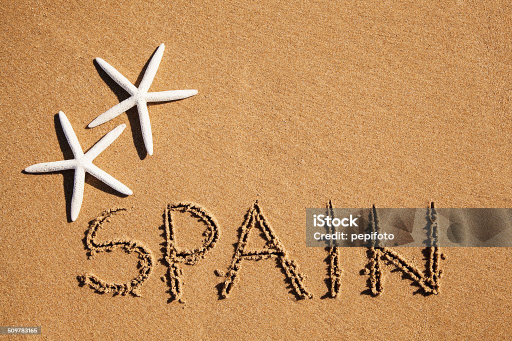 "Spain" carved in the sand "Spain" carved in the sand  Beach Stock Photo