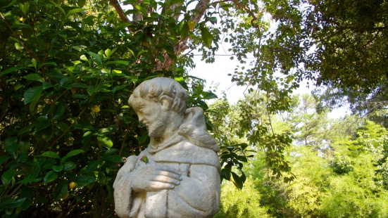 Statue of St. Francis in a garden.