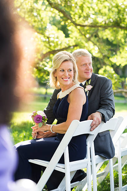 istock Parents beaming with joy at an outdoor wedding 509784463
