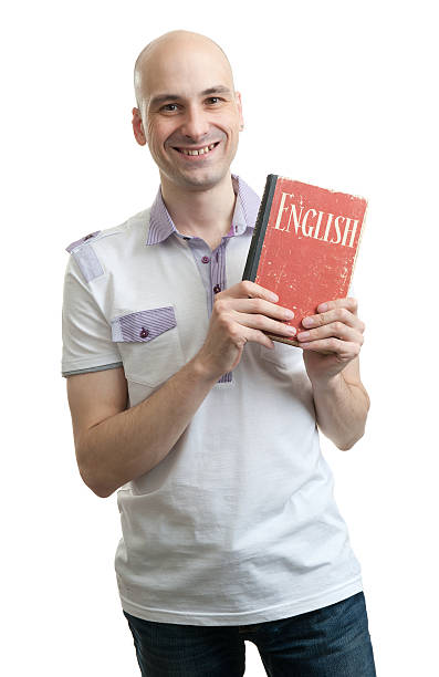 istock English education. Happy casual man with book 509785185