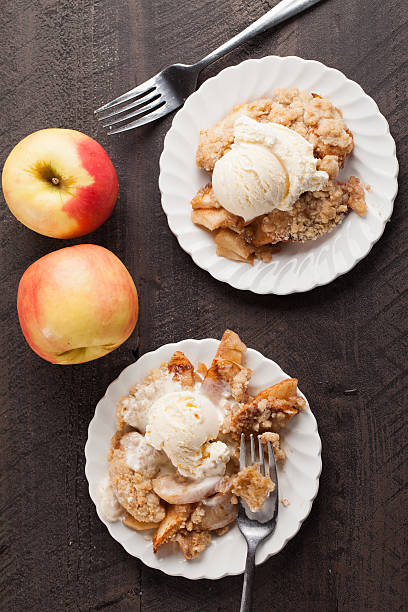 istock Two dishes of apple crisp with ice cream 509785886
