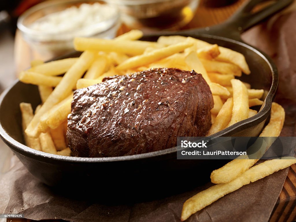 Steak and Fries Steak Fillet Seasoned with Sea Salt, Fresh Cracked Pepper and hand Cut Fries -Photographed on Hasselblad H3D2-39mb Camera Barbecue - Meal Stock Photo