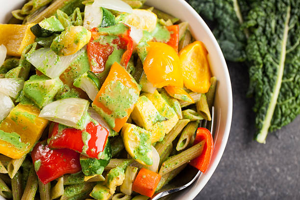 Close up of large bowl of pasta and roasted vegetables