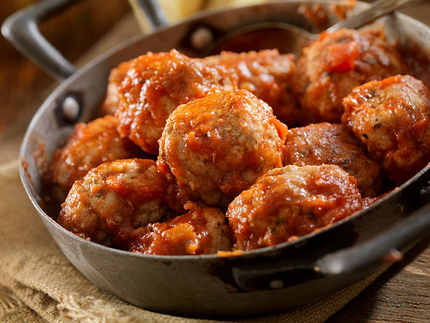 Turkey Meatballs Italian Style Turkey Meatballs in a Tomato Sauce -Photographed on Hasselblad H3D2-39mb Camera meatball stock pictures, royalty-free photos & images