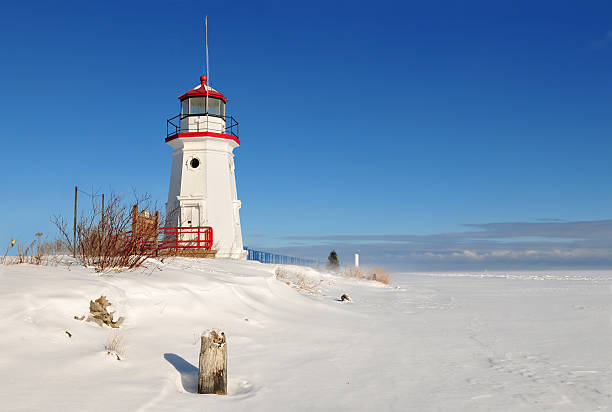 Cheboygan Crib Light Cheboygan Crib Light is a light that marks the west pier head of the mouth of the Cheboygan River into Lake Huron in Cheboygan, Michigan, USA. upper peninsula michigan snow stock pictures, royalty-free photos & images