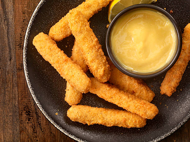 Chicken Fries with Honey Mustard Dip All White Meat Chicken Fries with Honey Mustard Dip - Photographed on Hasselblad H3D2-39mb Camera chicken finger stock pictures, royalty-free photos & images