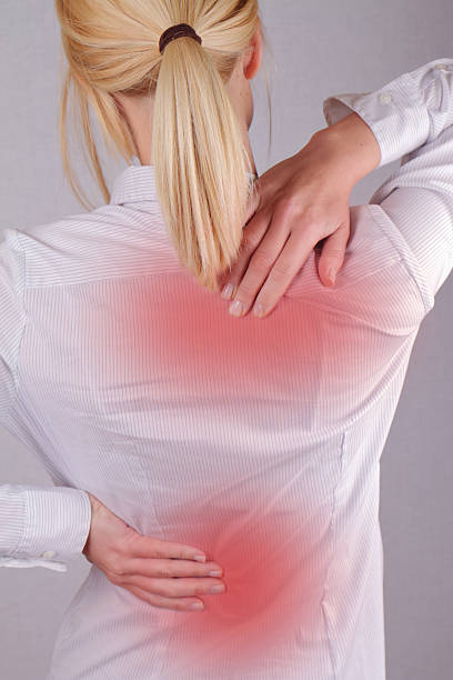 istock Woman with neck / back pain. 509790994