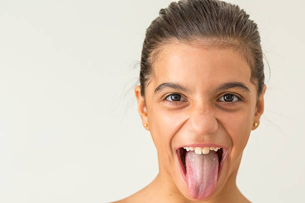 istock Young gril showing tongue 509791976