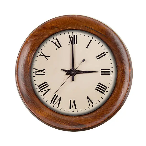 Vintage clockface showing three o'clock in wooden frame isolated over white